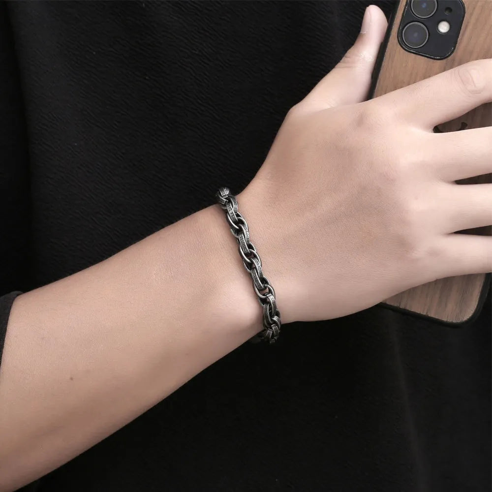 Person wearing a  stainless steel rope chain bracelet on the wrist.