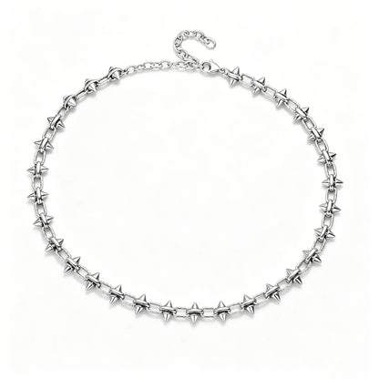 Close-up of industrial punk spiked chain necklace showing high-polish 316L stainless steel construction.
