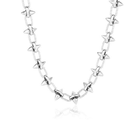 Close-up of industrial punk spiked chain necklace showing high-polish 316L stainless steel construction.