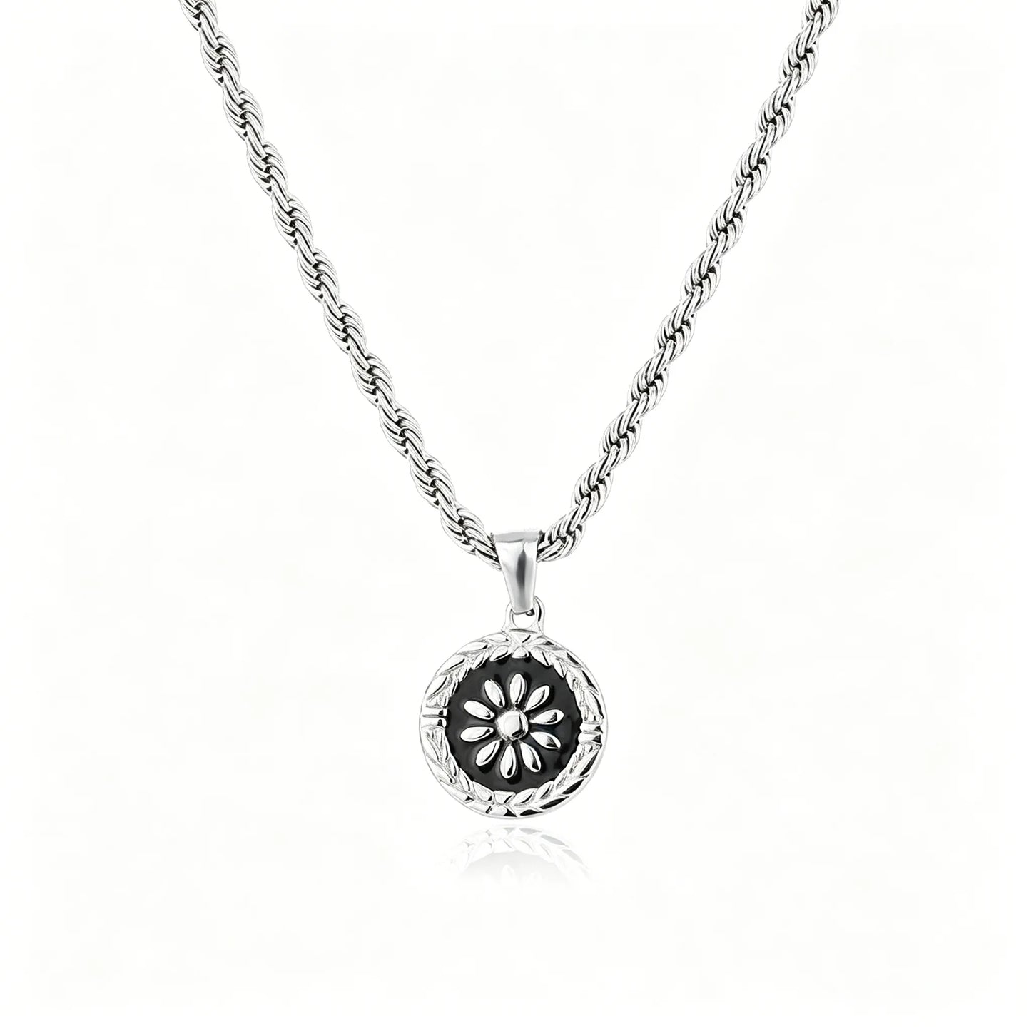 Silver-tone floral medallion pendant necklace with black enamel round charm