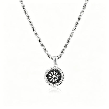 Silver-tone floral medallion pendant necklace with black enamel round charm
