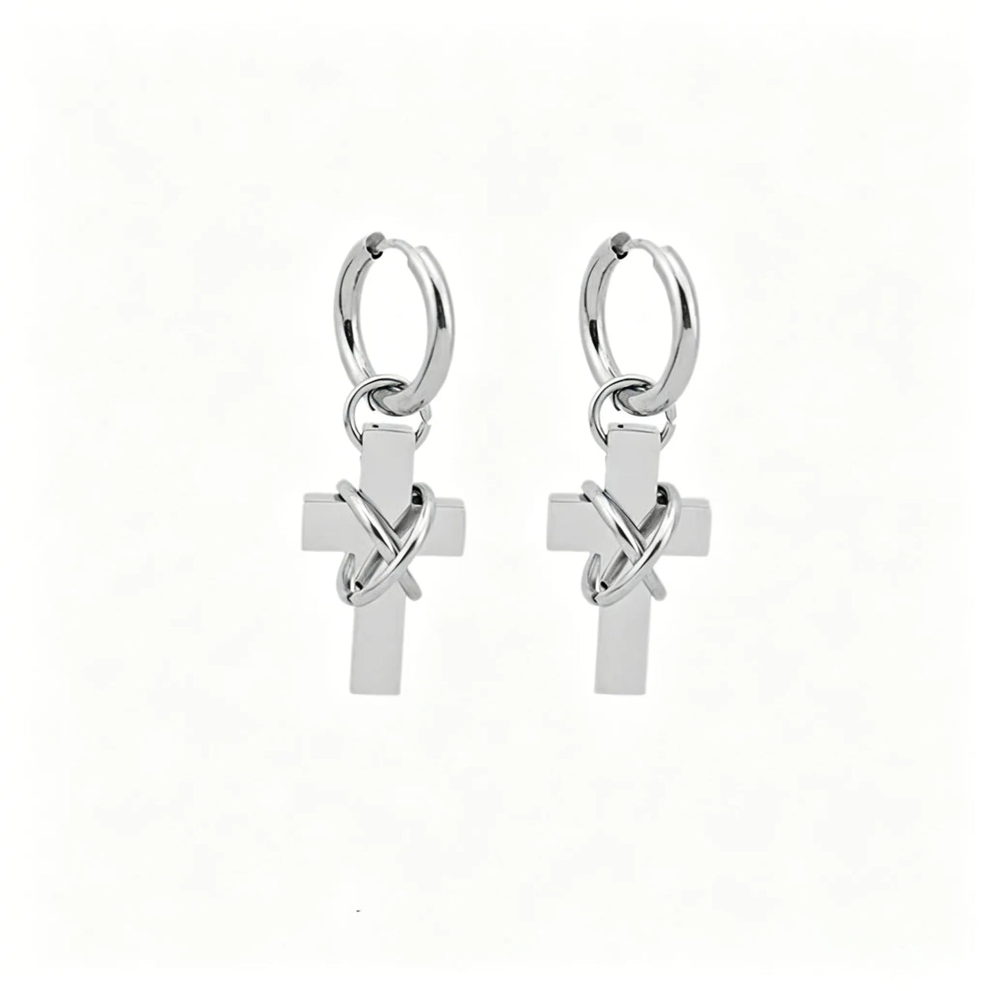 Barbed cross hoop earrings in polished stainless steel with dangling cross pendants.
