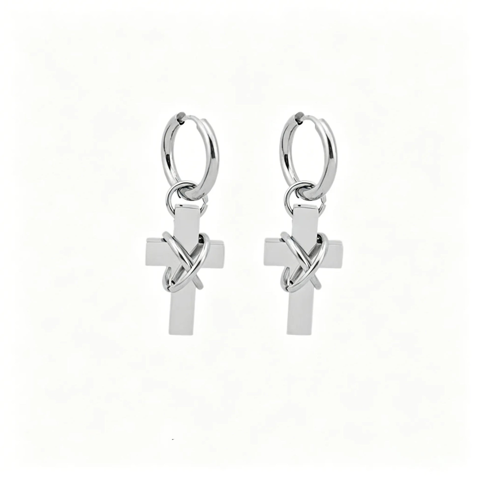 Barbed cross hoop earrings in polished stainless steel with dangling cross pendants.