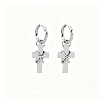 Barbed cross hoop earrings in polished stainless steel with dangling cross pendants.
