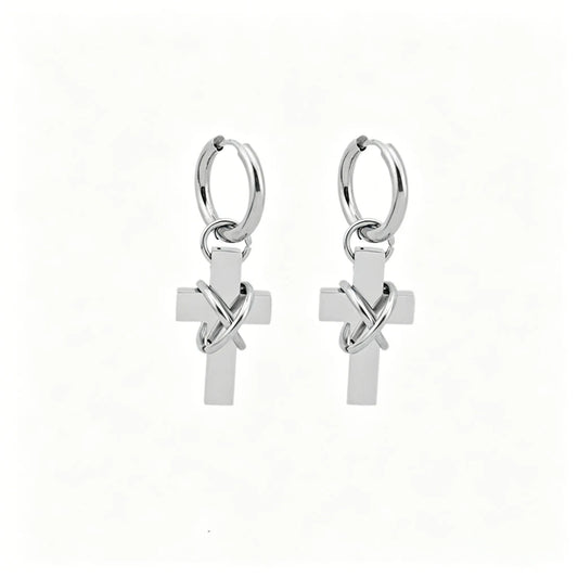 Barbed cross hoop earrings in polished stainless steel with dangling cross pendants.