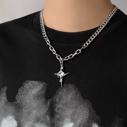 Model wearing a stainless steel crystal star pendant chain necklace with a black streetwear shirt.