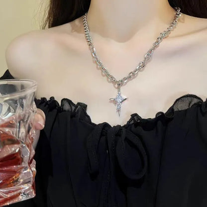 Model wearing a stainless steel crystal star pendant chain necklace with a black streetwear shirt.