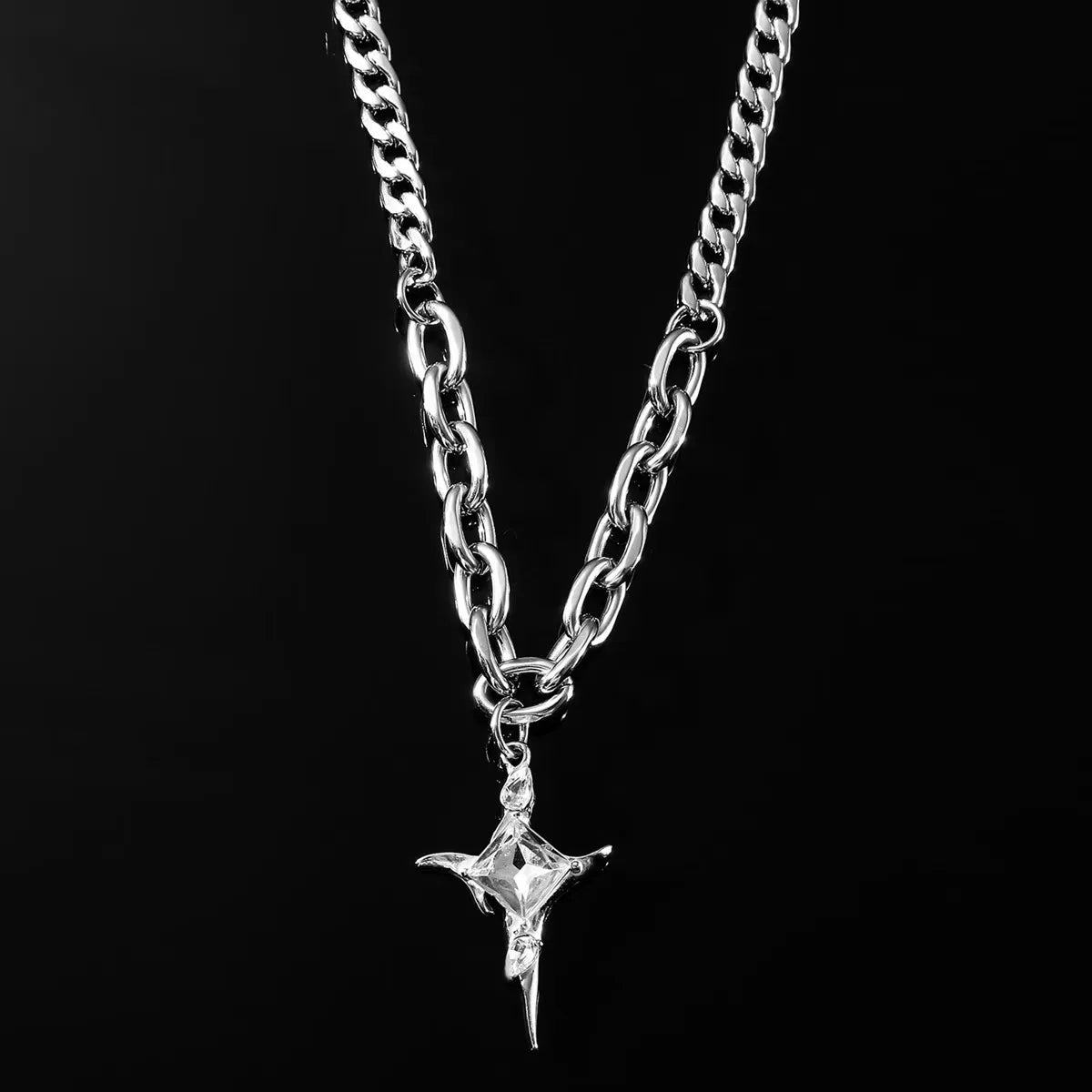 Crystal star pendant necklace with stainless steel Cuban and oval link chain in polished silver.