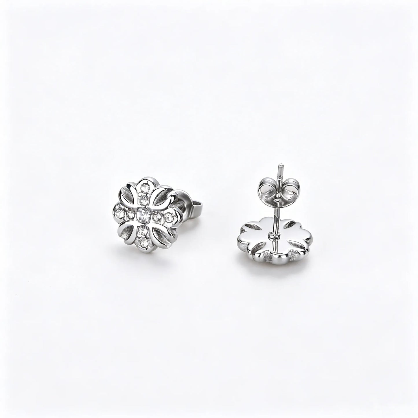 Silver-tone unisex floral stud earrings made of 316L stainless steel with zirconia accents.