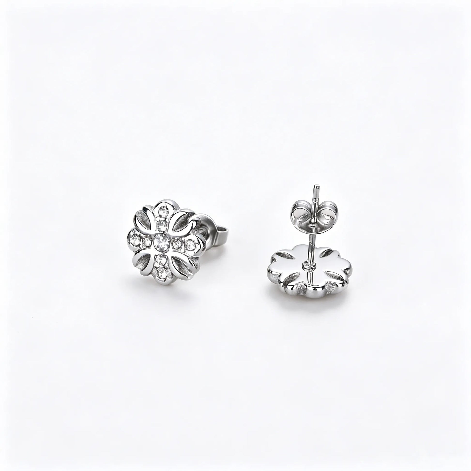 Silver-tone unisex floral stud earrings made of 316L stainless steel with zirconia accents.