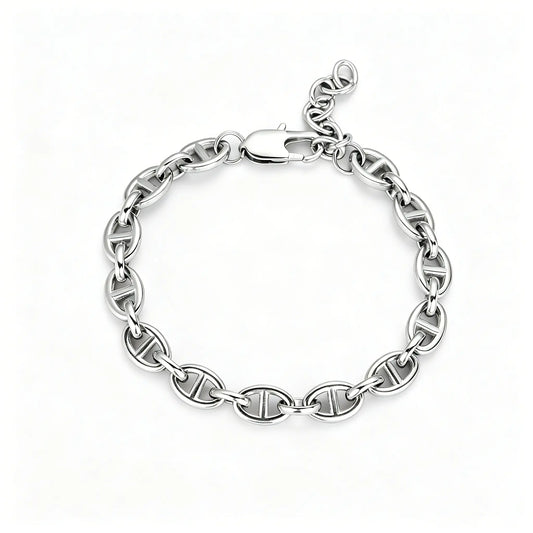 Silver stainless steel oval link chain bracelet with lobster clasp and adjustable extension chain on a white background.
