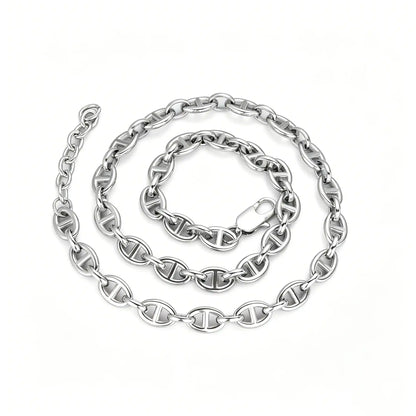 Silver stainless steel oval link chain bracelet with lobster clasp and adjustable extension chain on a white background.