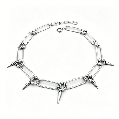 Stainless steel spike link chain choker necklace with polished silver finish and hanging spike accents.